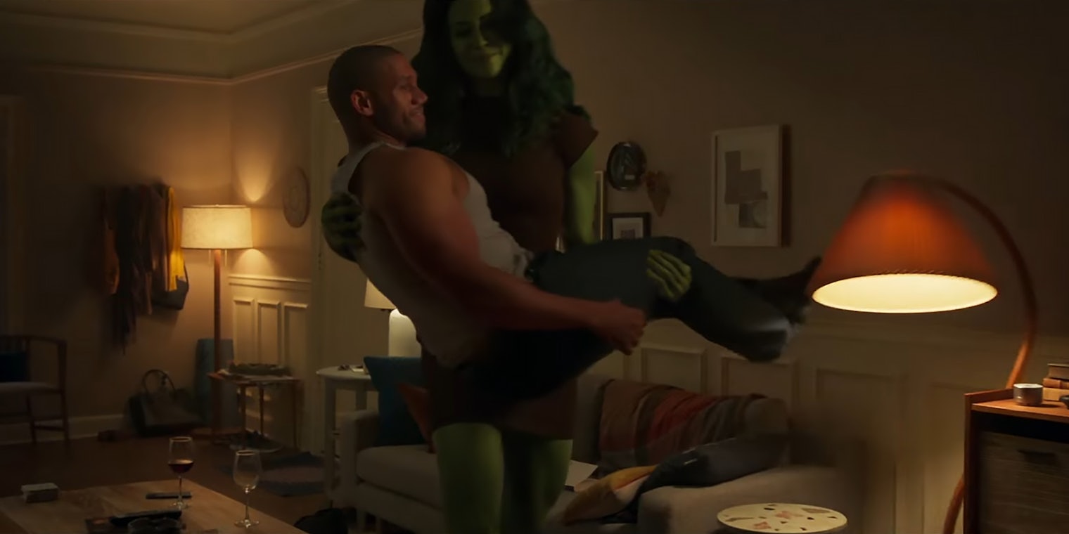 She-Hulk carrying man through living room