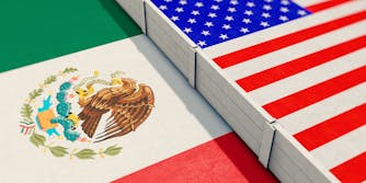 Mexico flag design with wall between America flag design