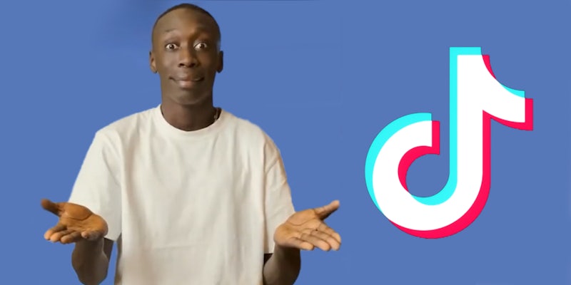 Khaby Lame hands out classic hand gesture on blue background with TikTok logo on right