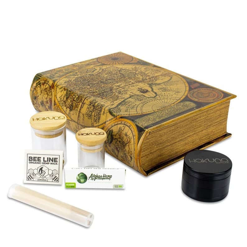 Atlas stash box book with clear glass jar and rolling papers.