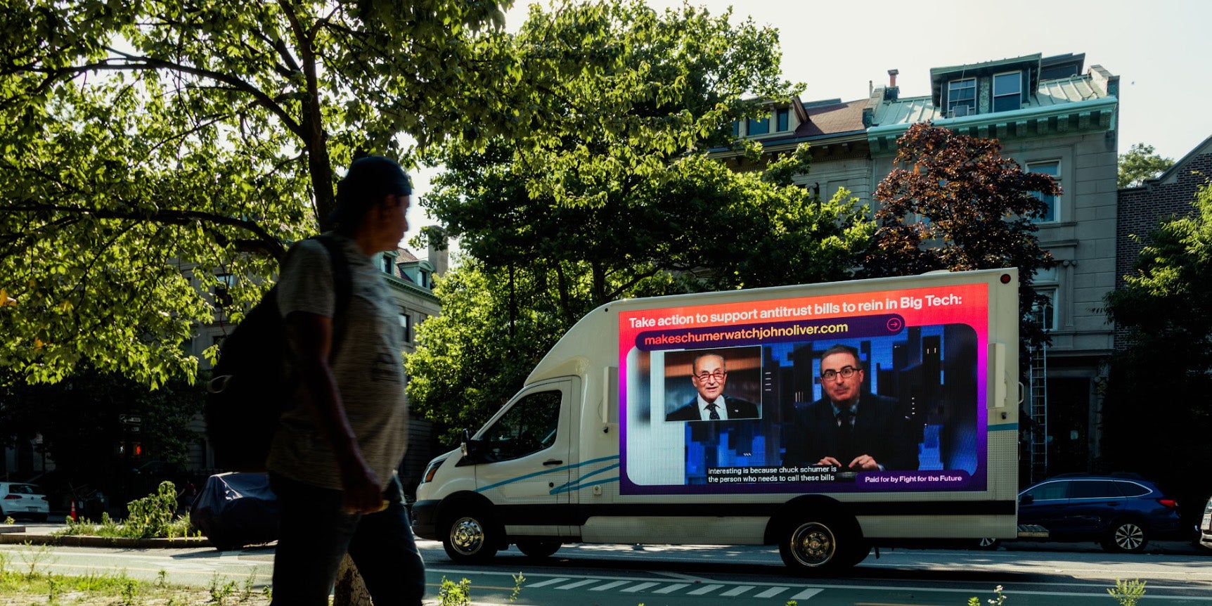 A mobile billboard outside Chuck Schumer's house supporting the antitrust bills in Congress.