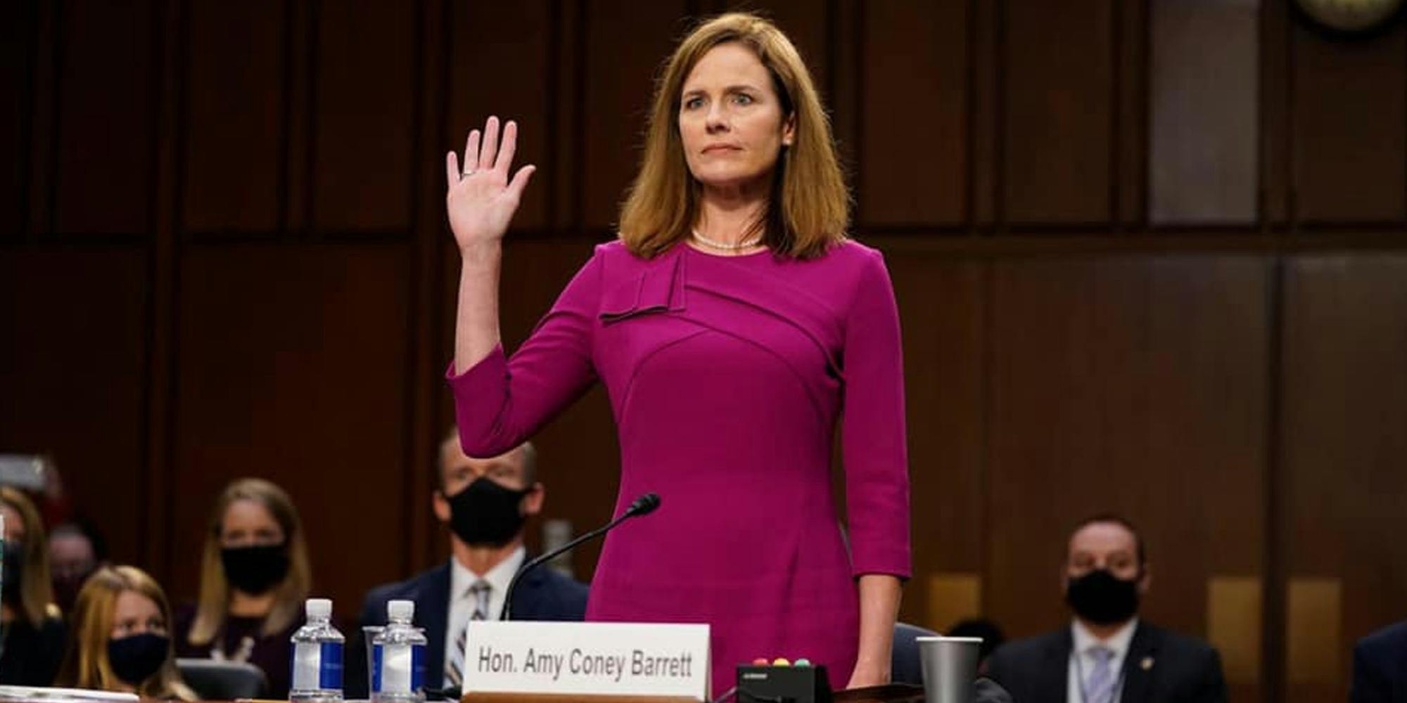 Amy Coney Barrett standing in court right hand raised