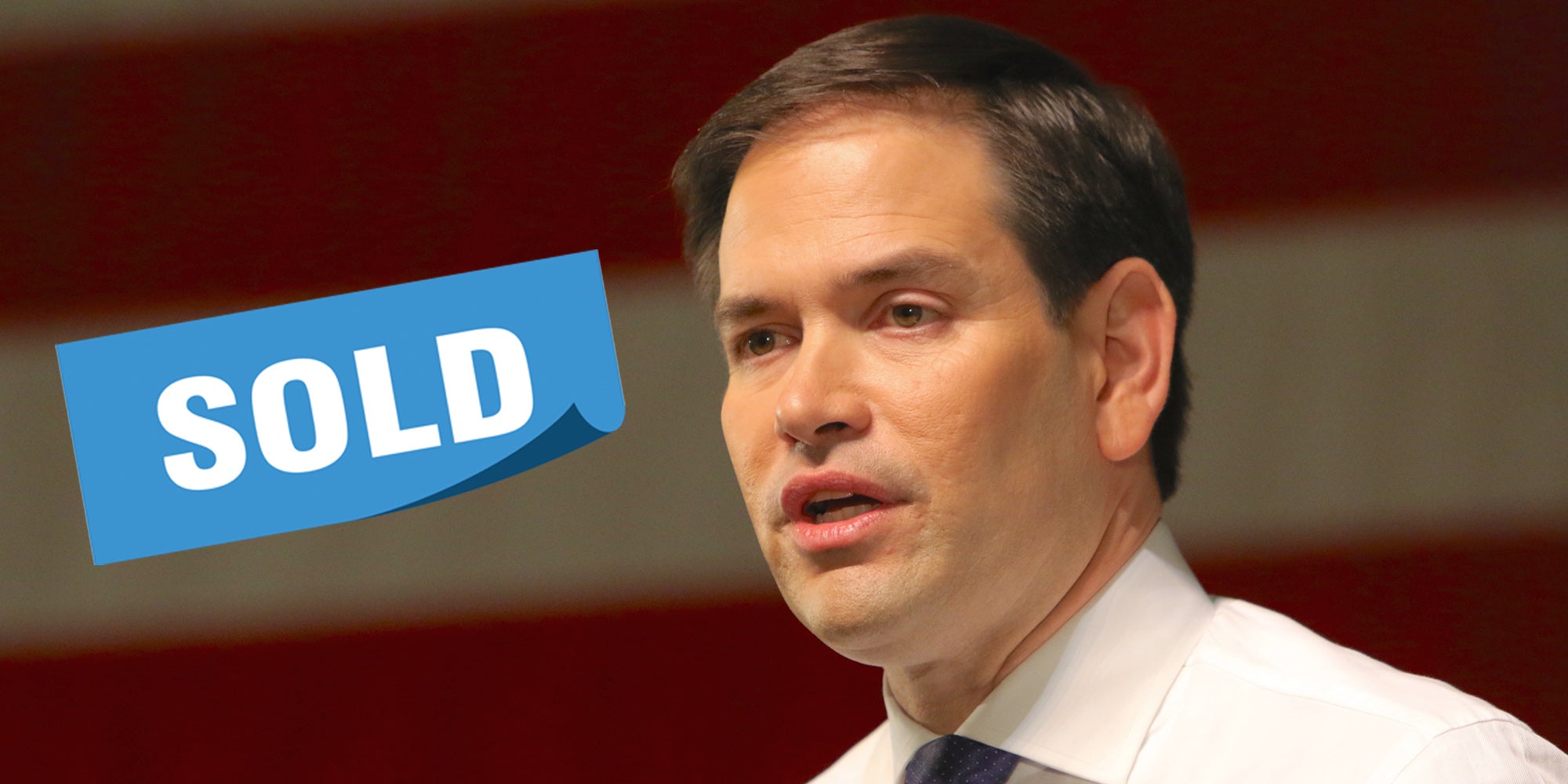 Marco Rubio speaking American flag blurred behind him blue 'sold' rectangular banner left