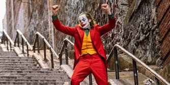 Joker hands up on stairs