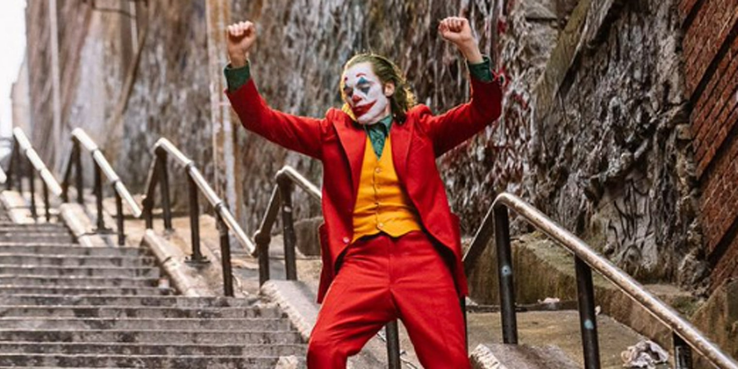 Joker hands up on stairs