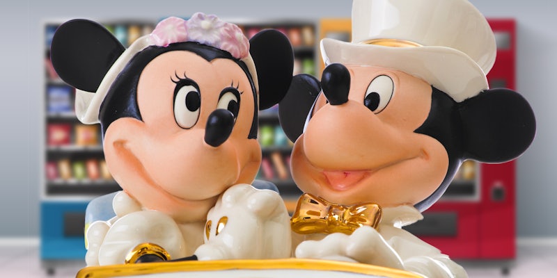 Mickey and Minnie mouse in wedding outfits in front of vending machines