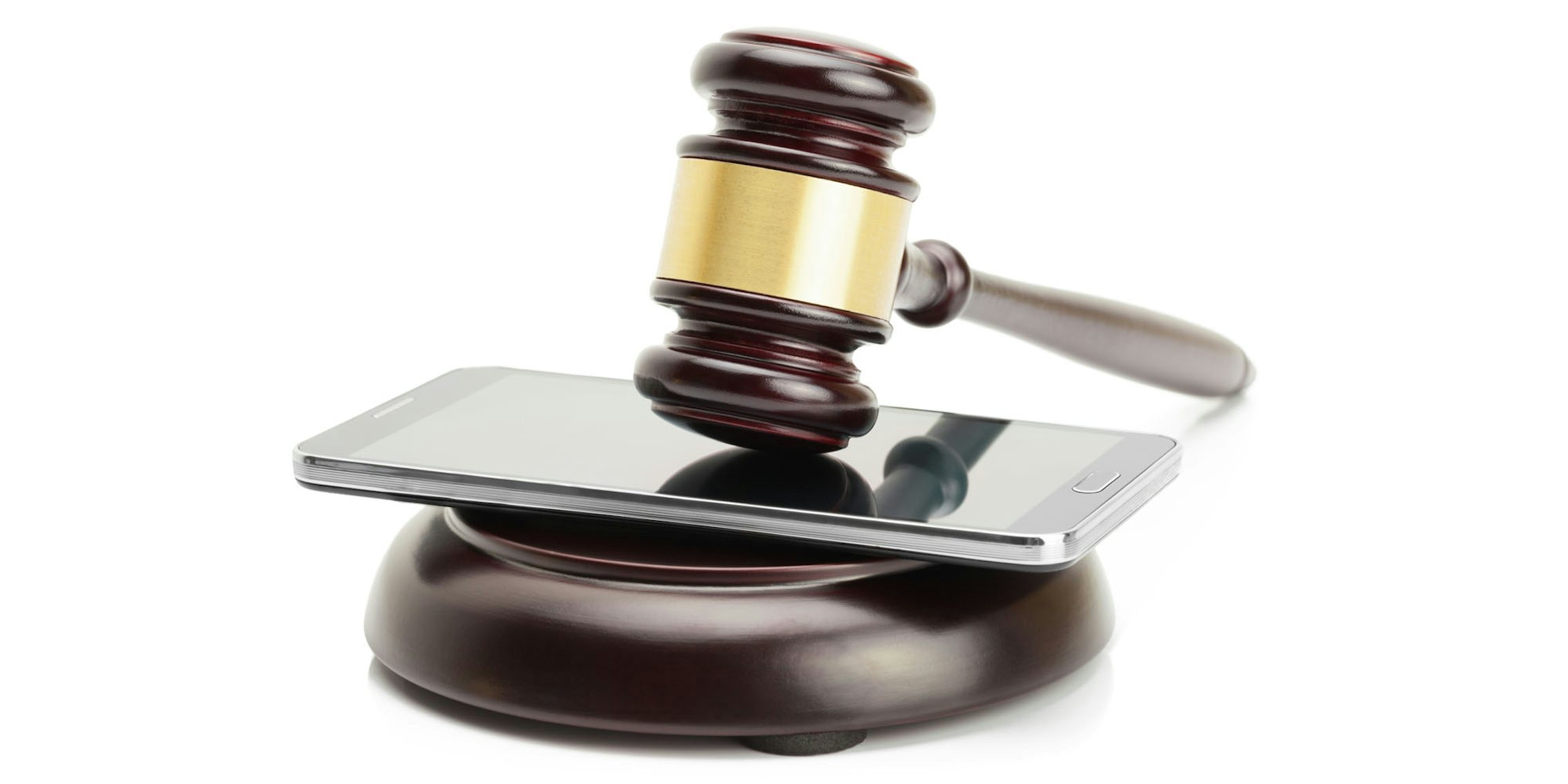 Judge gavel on cell phone white background