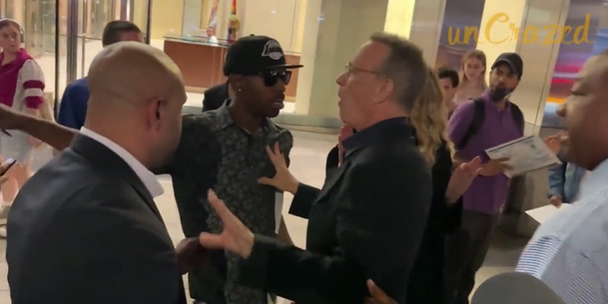 Tom Hanks hands out yelling into group at man who pushed wife