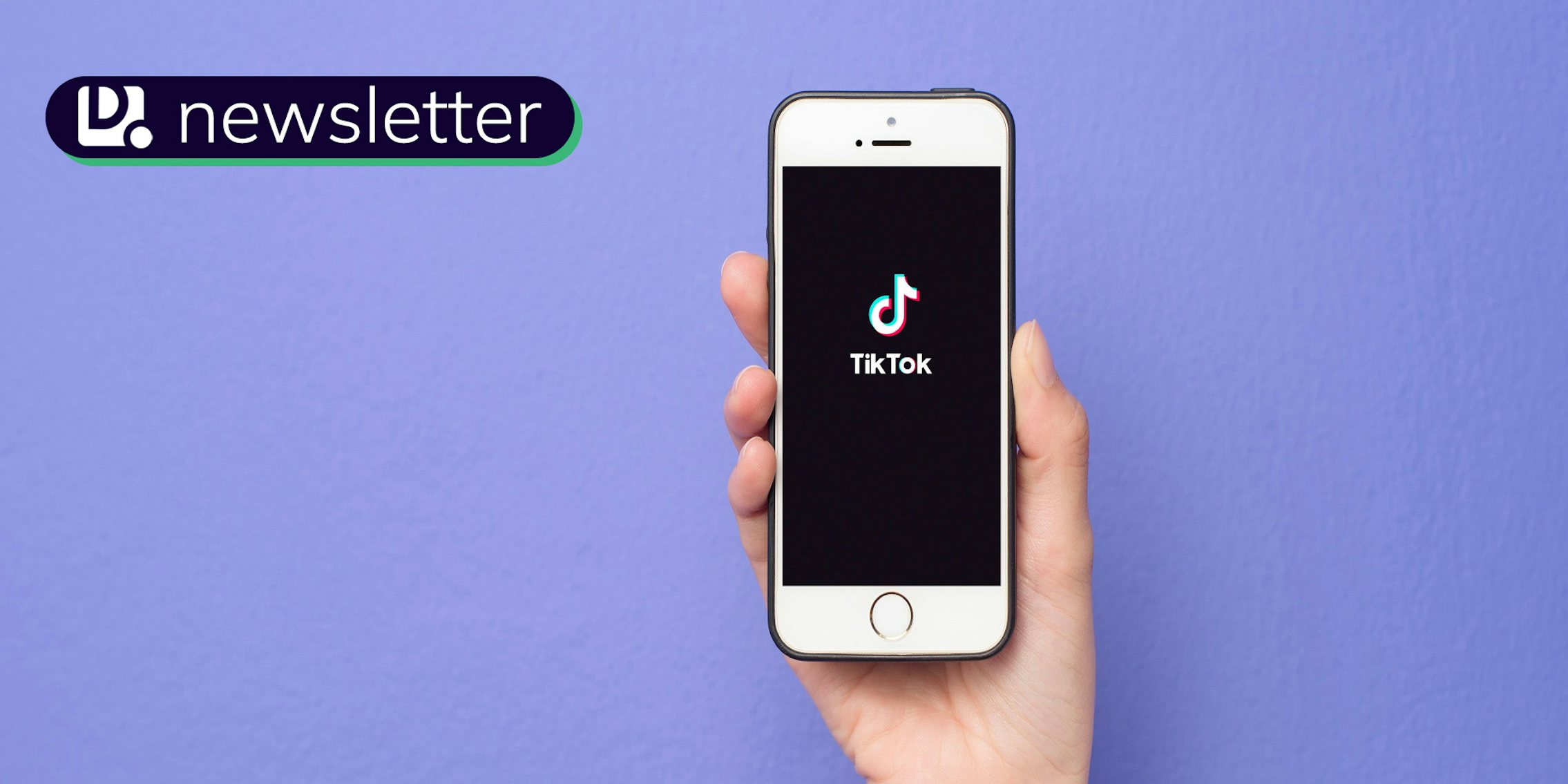 A hand holding a smartphone with the TikTok logo on it. In the top left corner is the Daily Dot newsletter logo.