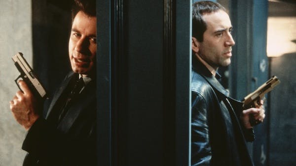 Face/Off scene of two actors on opposite sides of a door