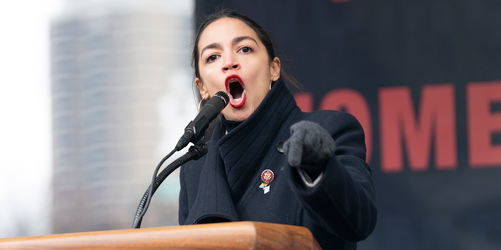 Alexandria Ocasio-Cortez United States Representative speaking into microphone hand pointed out
