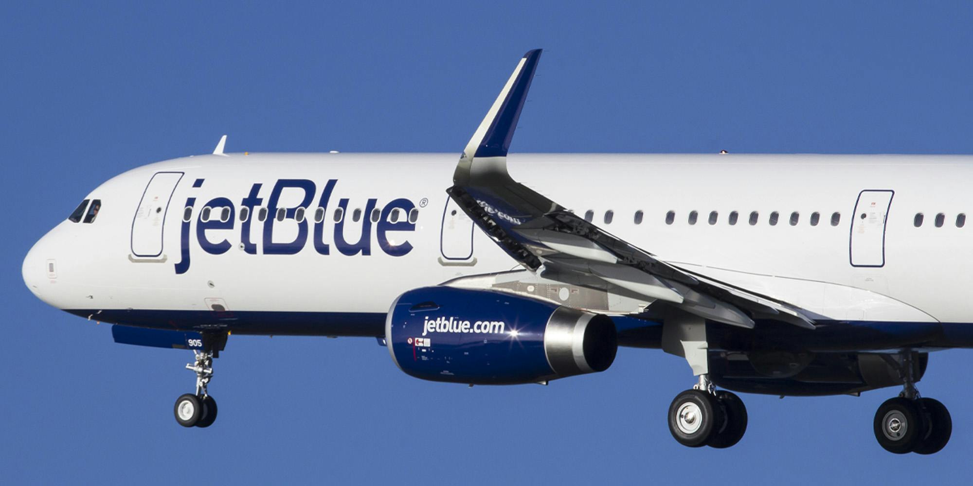 JetBlue airlines plane in blue sky