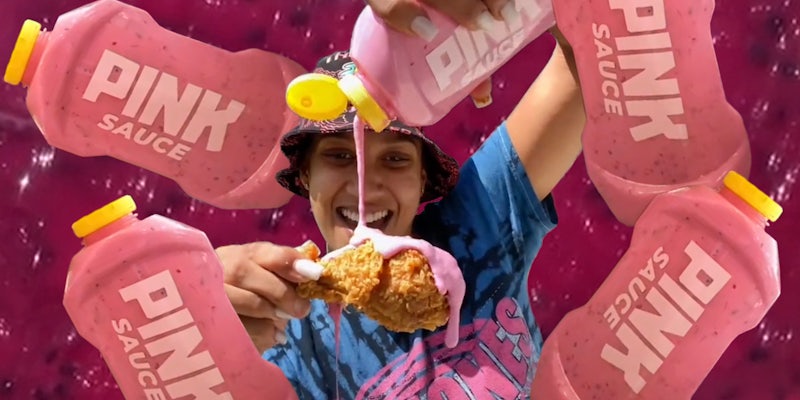 Woman pouring pink sauce onto fried chicken