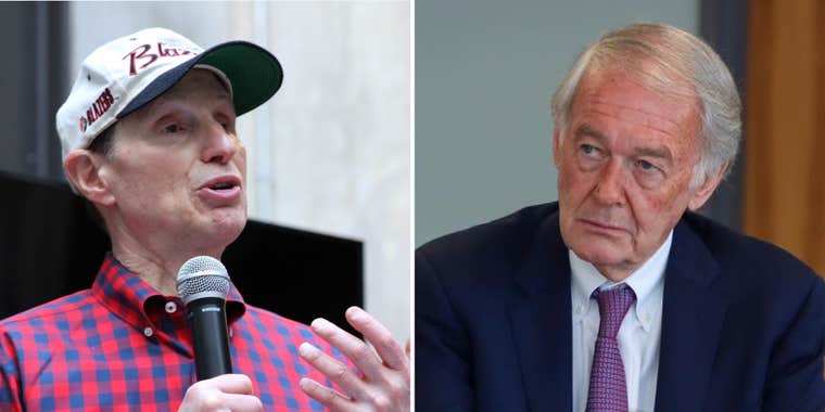 Ron Wyden speaking into microphone (l) Edward Markey (r)