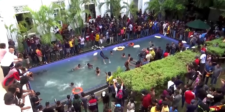 people diving into large pool