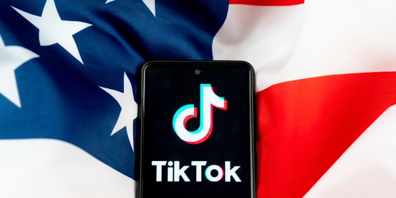 phone with TikTok app on screen on American flag