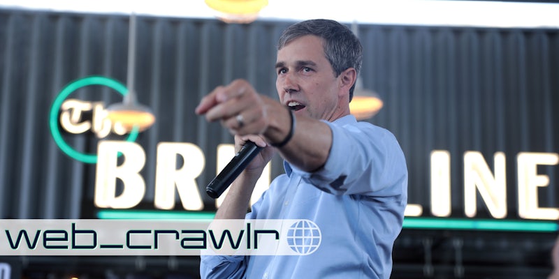 Beto O'Rourke holding a microphone and pointing. The Daily Dot newsletter web_crawlr logo is in the bottom left corner.