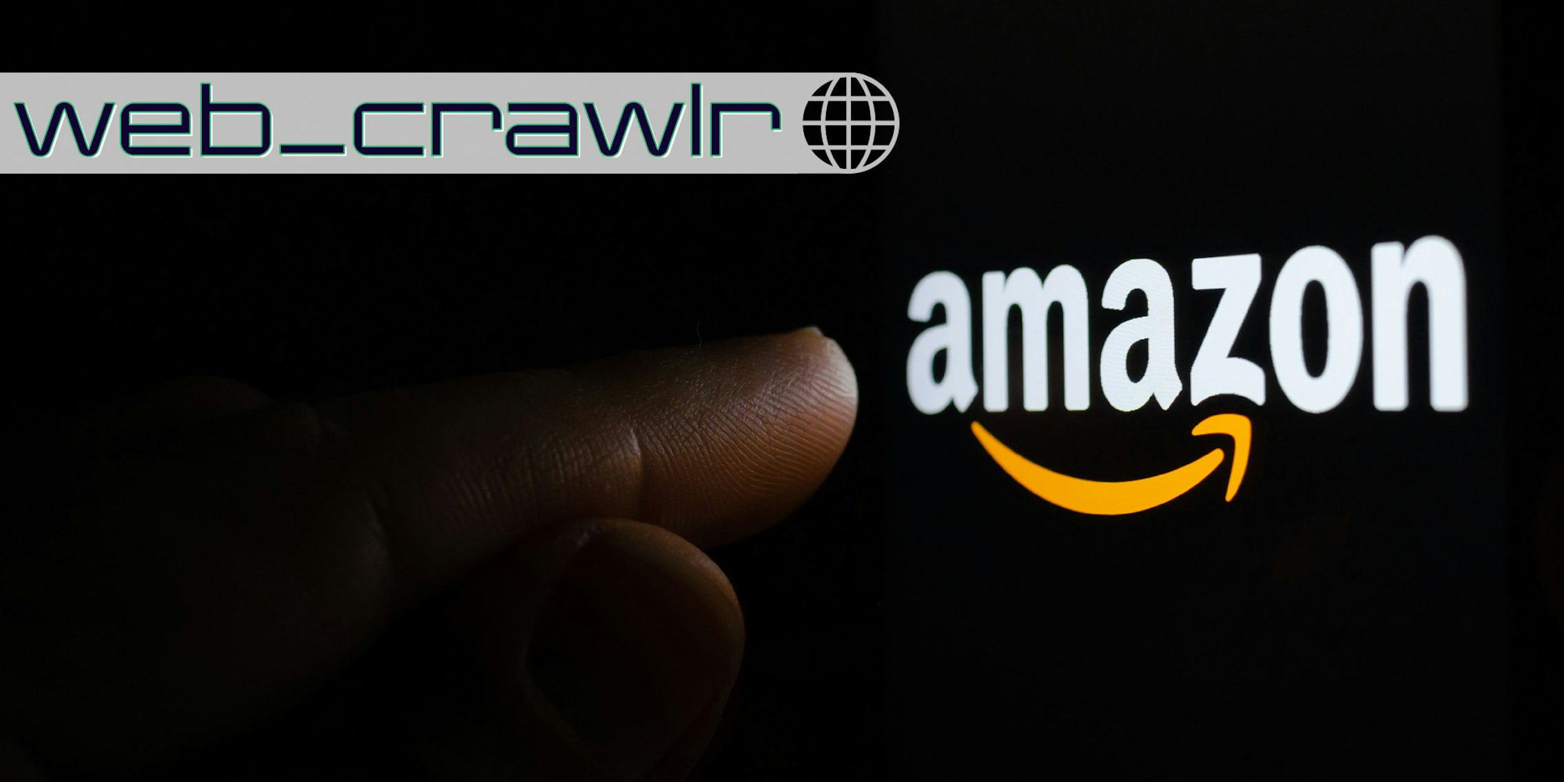 Amazon logo on a screen in a dark and finger pointing at it. The Daily Dot newsletter web_crawlr logo is in the top left corner.
