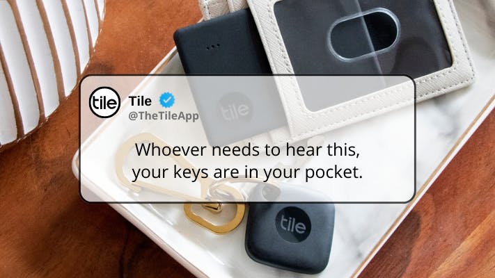 Tile Bluetooth tracker on key and in wallet with a tweet from Tile overlayed