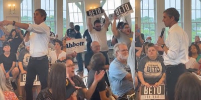 Beto O'Rourke speaking to crowd pointing arm left (l) crowd at town hall meeting holding BETO signs cheering (c) Beto O'Rourke speaking to crowd (r)