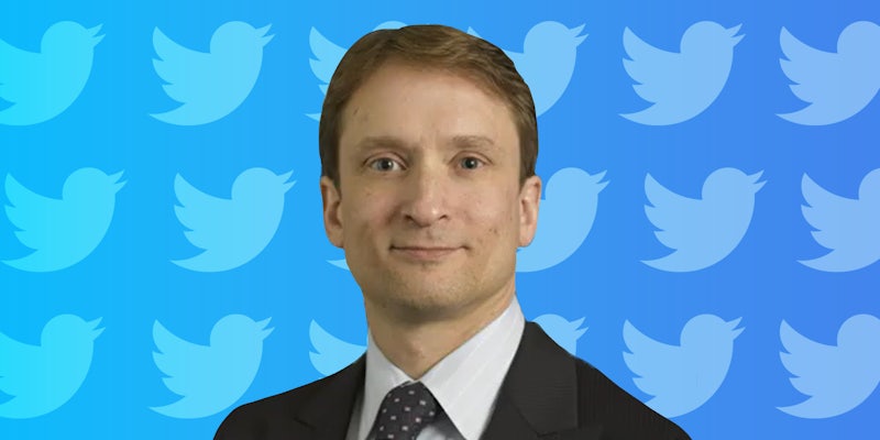 Pieter Zatko in suit on blue gradient Twitter bird pattern background