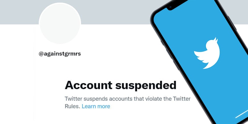 Twitter account suspended '@againstgrmrs Account Suspended Twitter suspends accounts that violate the twitter rules. Learn more' iPhone with Twitter app loading on right