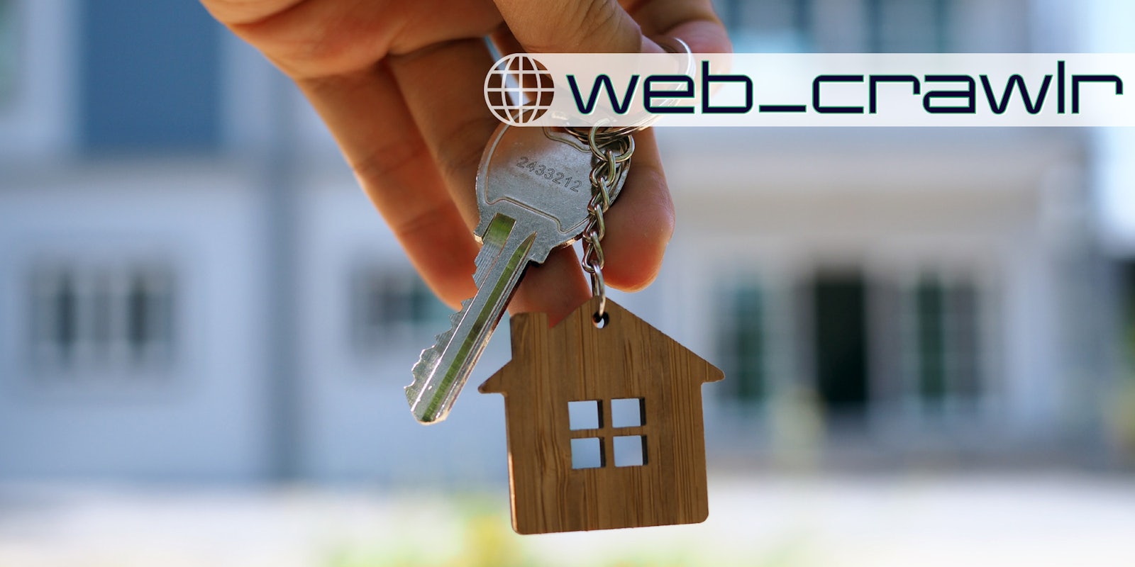 A person holding a keychain with a home on it. The Daily Dot newsletter web_crawlr logo is in the top right corner.