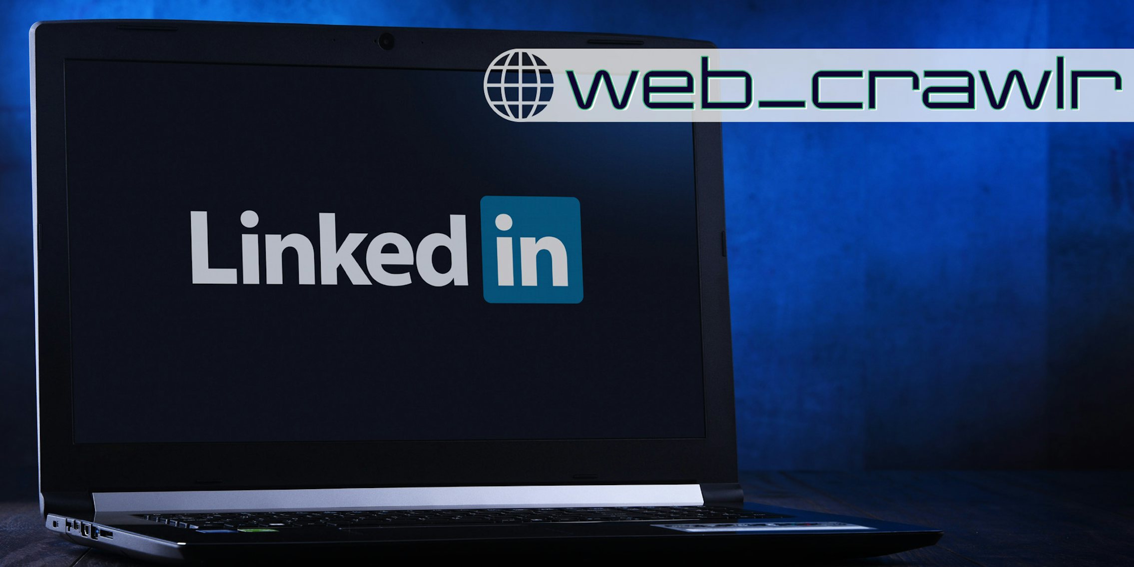 A laptop showing the LinkedIn logo on it. The Daily Dot newsletter web_crawlr logo is in the top right corner.