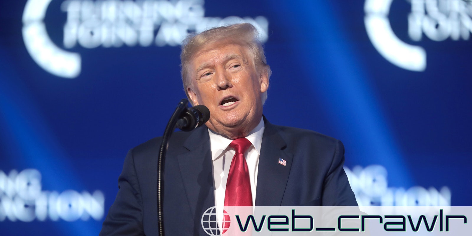 Former President Donald Trump speaking into a microphone. The Daily Dot newsletter logo is in the bottom right corner.