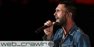 Adam Levine singing into a microphone. The Daily Dot newsletter web_crawlr logo is in the bottom left corner.