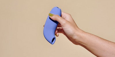 hand holding a sucker-type sex toy