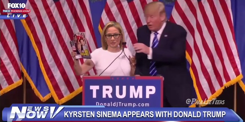 Donald Trump on stage with Kristen Synema holding People magazine, deepfaked video