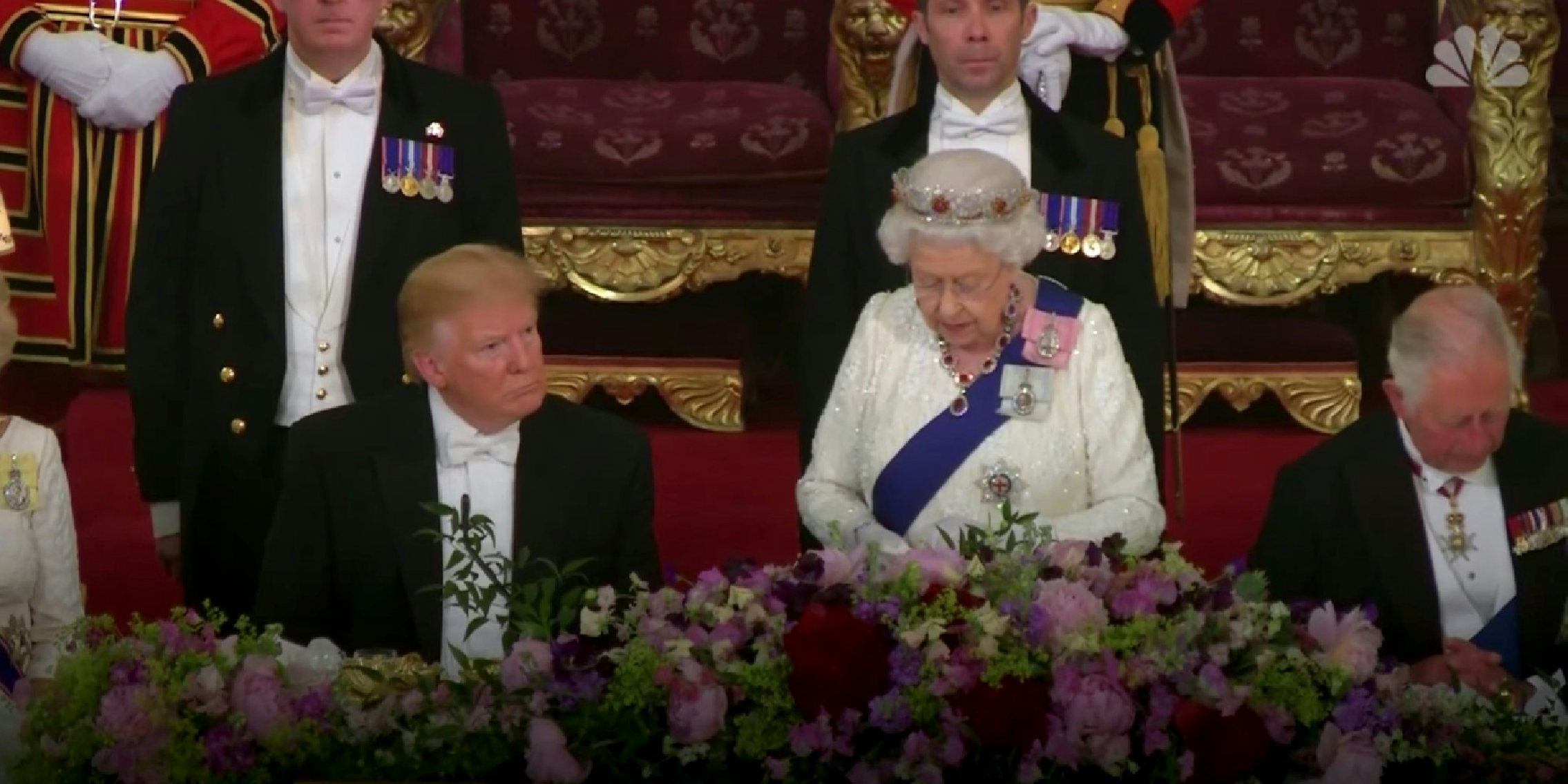 Donald Trump sitting next to Queen Elizabeth II