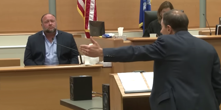 Alex Jones on the stand in a court room