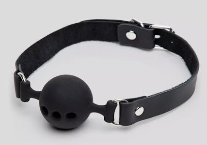 Bondage Boutique medium ball gag with three holes in the ball against a grey background.