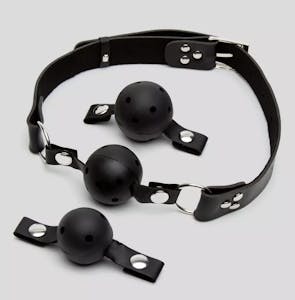 The Fetish Fantasy breathable ball gag training system with three different sized balls against a grey background.