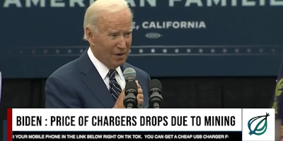 President Joe Biden holding a microphone and giving a speech