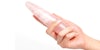 A hand holding the Chakrubs rose quartz wand against a white background