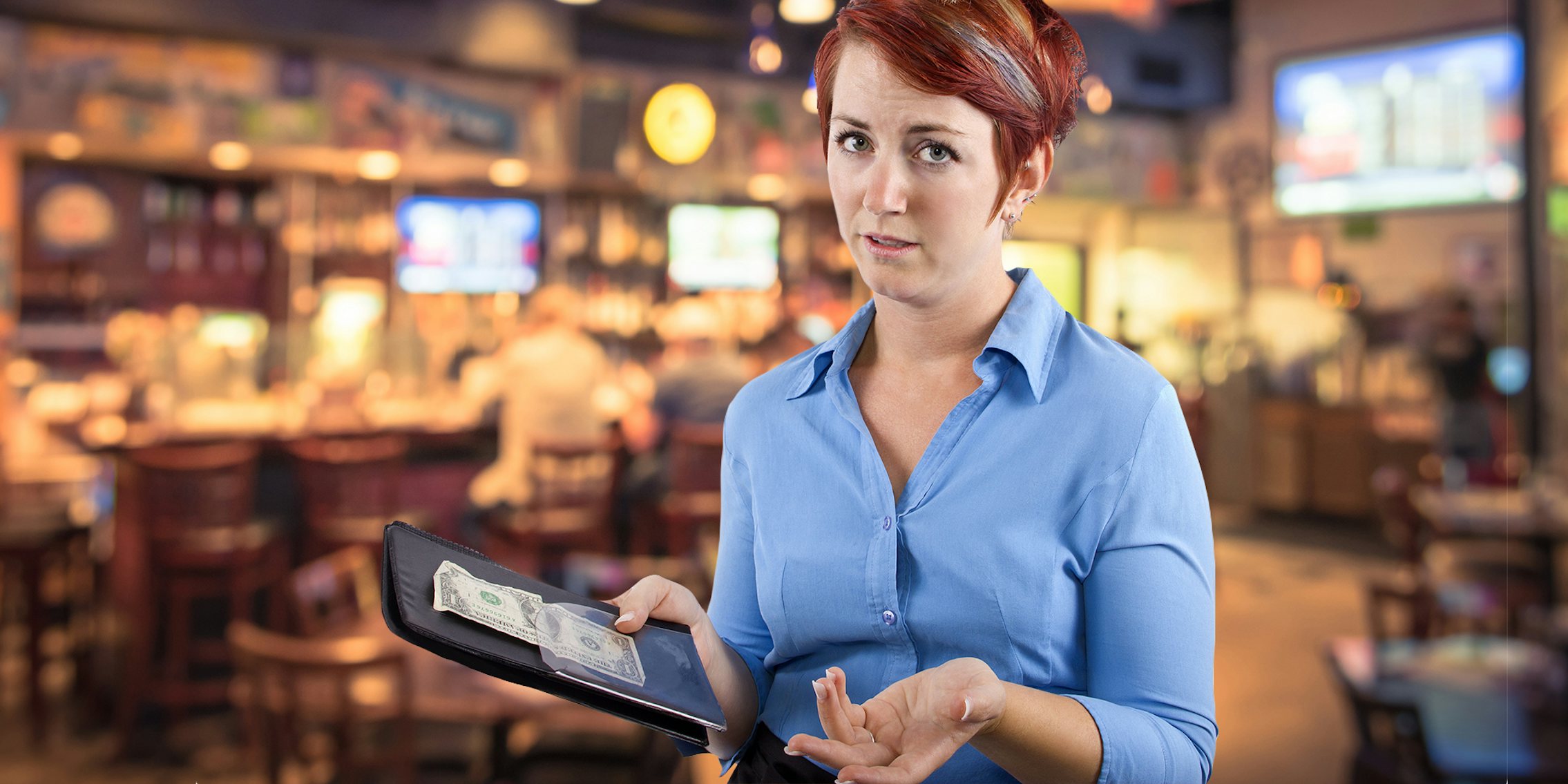 waitress shrugging with small tip in restaurant