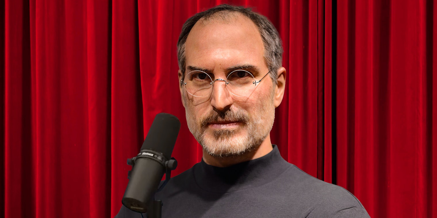 Steve Jobs wax statue with microphone and red curtain background