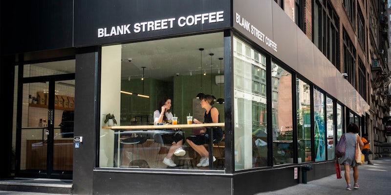 Blank Street Coffee shop with sign in city