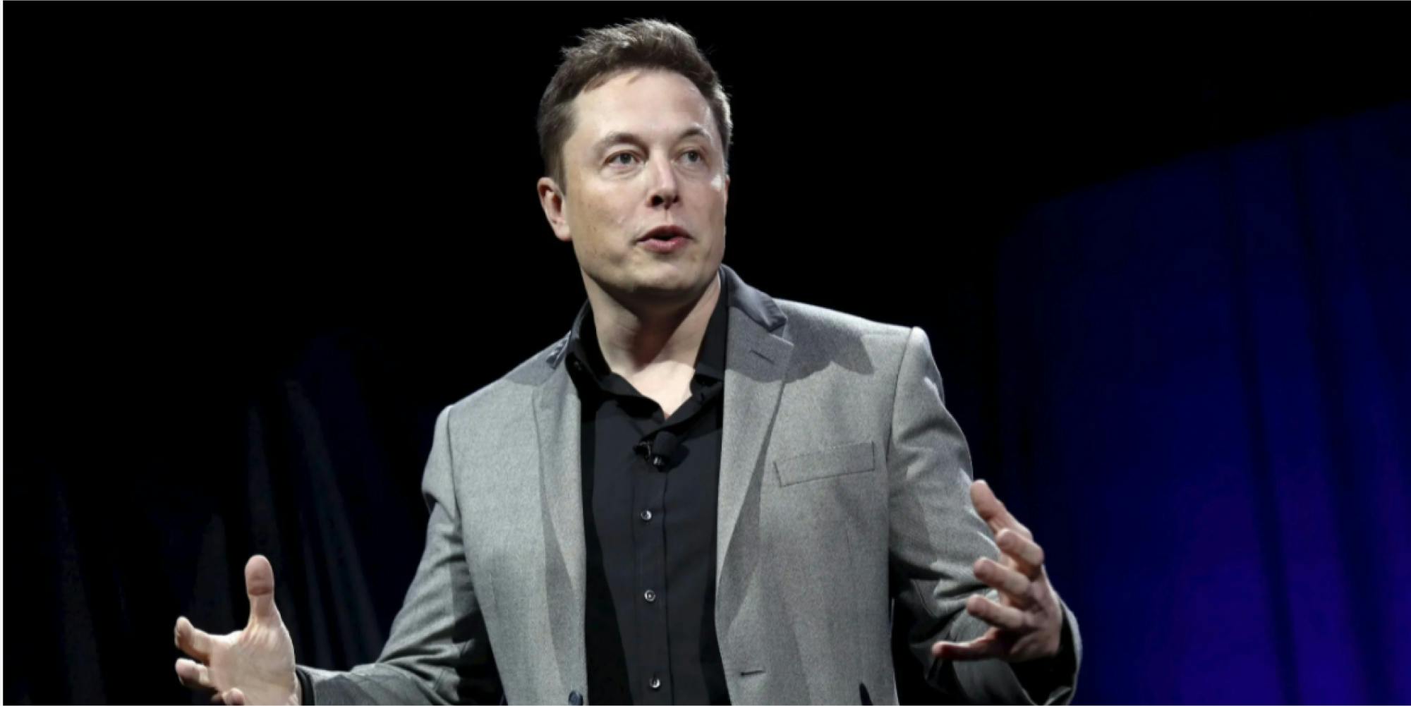 elon musk speaking at an event photo