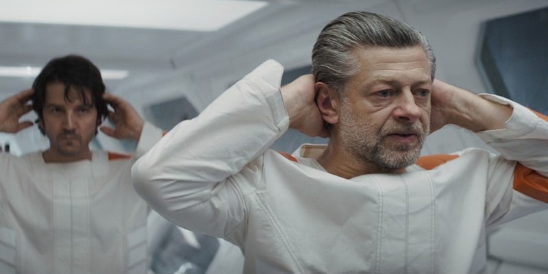 Andor episode 9 scene with Andy Serkis speaking and hands behind head