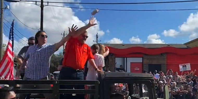 Beer flies at Ted Cruz during Astros World Series Parade