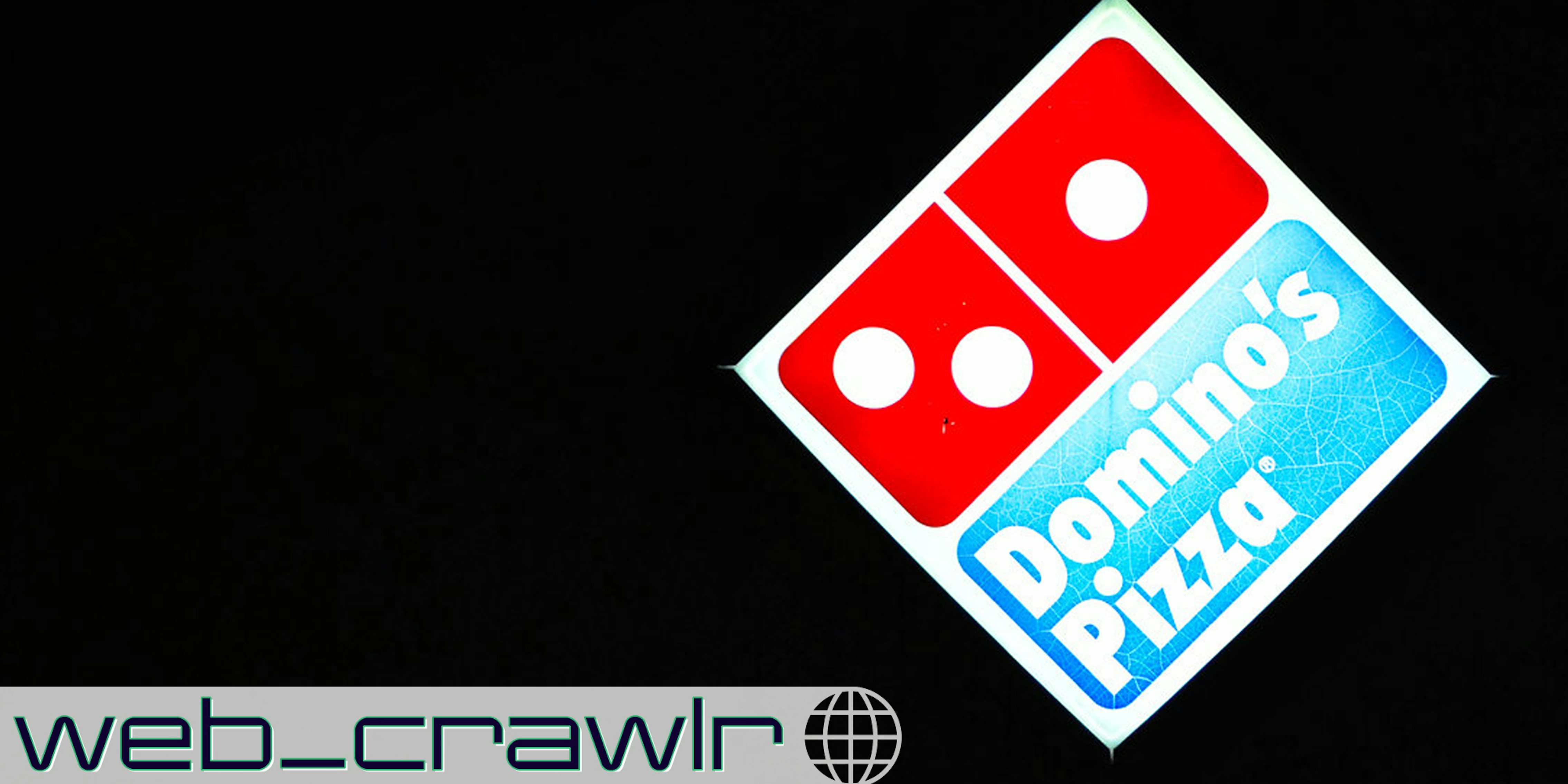 A Domino's pizza sign at night. The Daily Dot newsletter web_crawlr logo is in the bottom left corner.