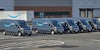 Amazon vans and truck in parking lot