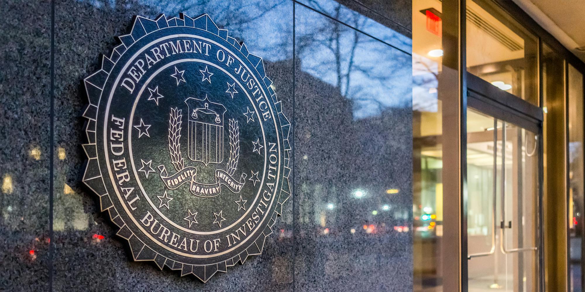 Department Of Justice Federal Bureau Of Investigation sign on wall with doorway