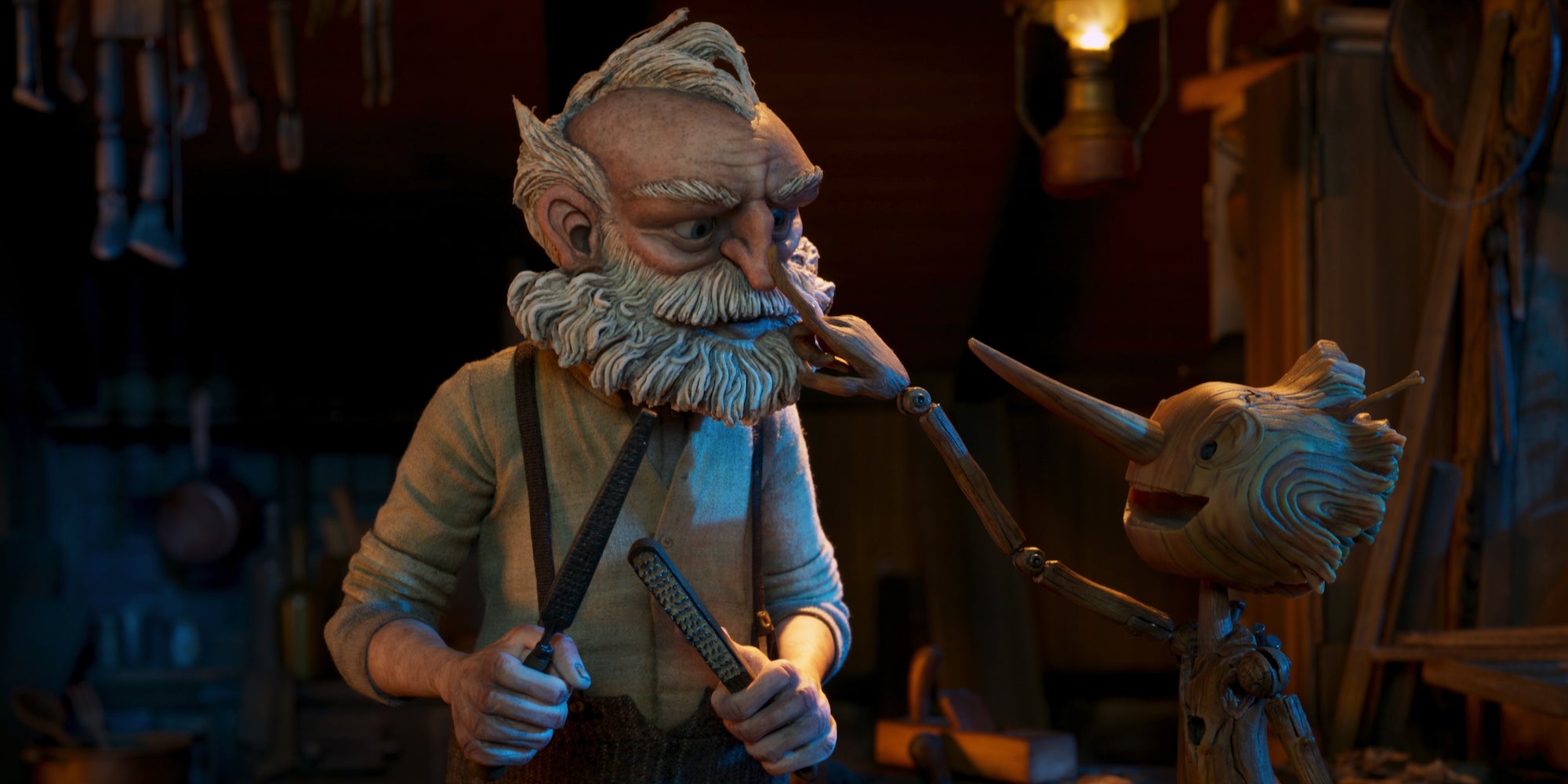 geppetto (left) and pinocchio (right) in guillermo del toro's pinocchio