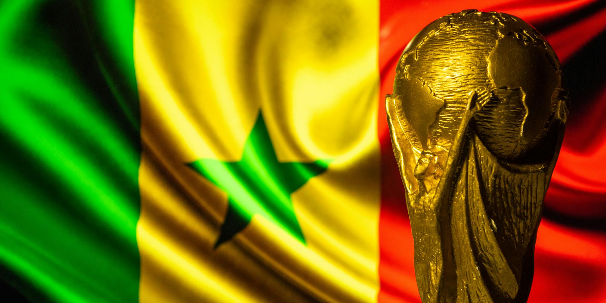 FIFA World Cup in front of flag of Senegal background