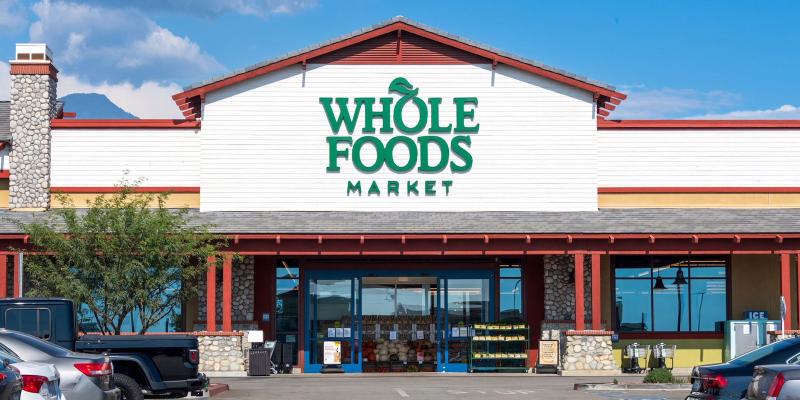 Whole Foods Market building with sign and parking lot